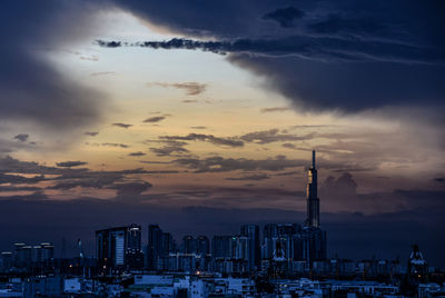View of buildings against cloudy sky during sunset