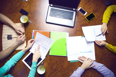 High angle view of man using laptop on table