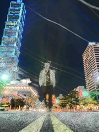 Buildings in city at night