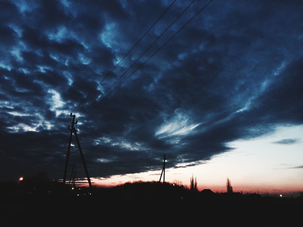 sky, silhouette, sunset, cloud - sky, electricity pylon, power line, cloudy, dramatic sky, dusk, electricity, cloud, low angle view, scenics, beauty in nature, nature, power supply, tranquil scene, tranquility, transportation, landscape