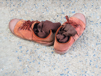 High angle view of shoes on tiled floor