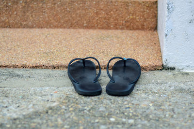 Close-up of shoes on wall