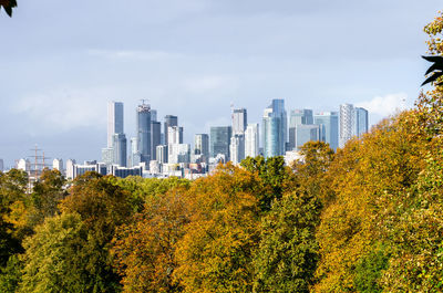 View of trees and buildings against sky