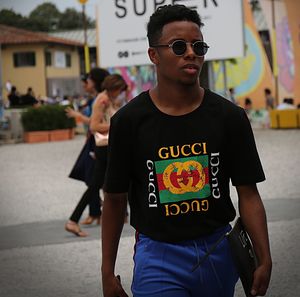 Mid adult man wearing sunglasses standing outdoors