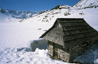 Scenic view of snow covered mountain against sky