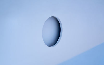 Close-up of circle shape on blue metal