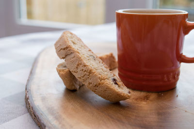 Close-up of bread and tea served on table