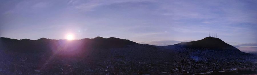 Scenic view of mountains against sky during sunset