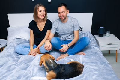Full length of young woman with dog
