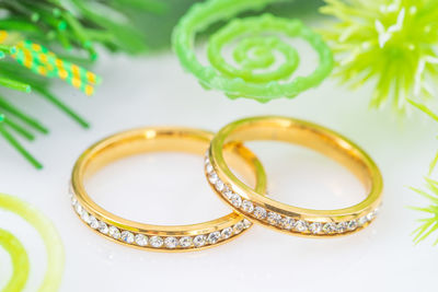 High angle view of wedding rings on table