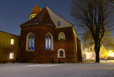 Building against sky during winter at night