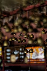 Close-up of illuminated lamp hanging in store