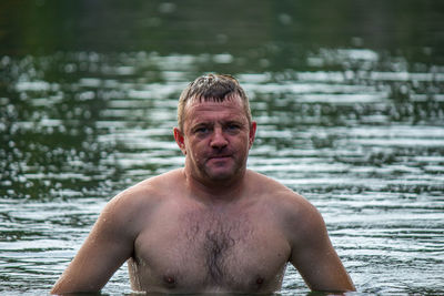 Portrait of shirtless man in water