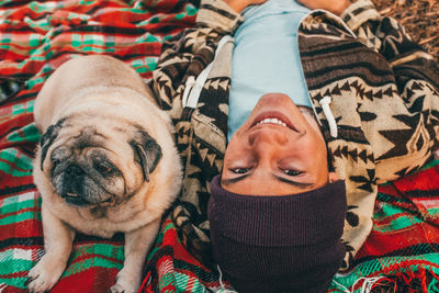 High angle portrait of girl with dog at home