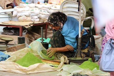 Woman making powder paint