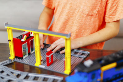 Midsection of man working on table