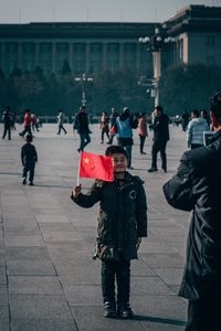 People walking on street in city