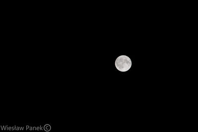 Scenic view of moon against clear sky at night