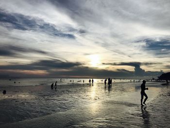 People walking on beach