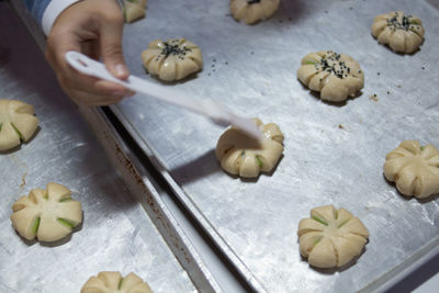 High angle view of person preparing food on cutting board