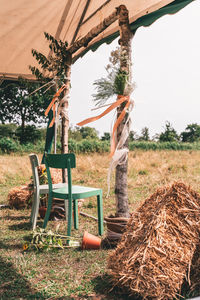 Beautiful outdoor wedding altar set-up with chairs for bride and groom with hay bales and sunflowers