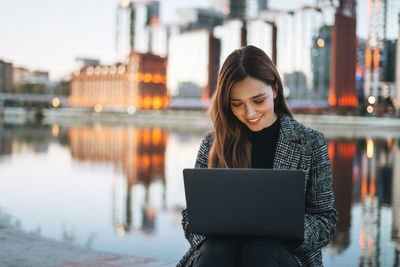 Young woman using mobile phone