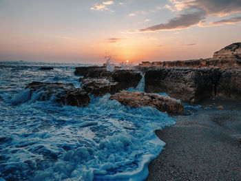 Scenic view of sea against sky during sunset