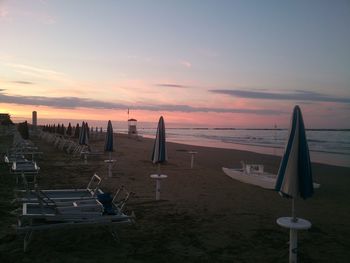 Scenic view of beach against sky during sunset