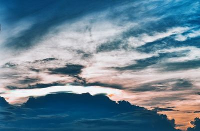 Low angle view of dramatic sky during sunset