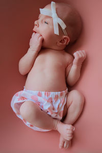 Midsection of shirtless baby girl