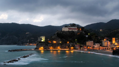 View of illuminated city at waterfront