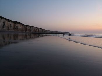 Scenic view of sea against clear sky during sunset