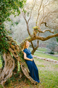 Portrait of a woman in a tree