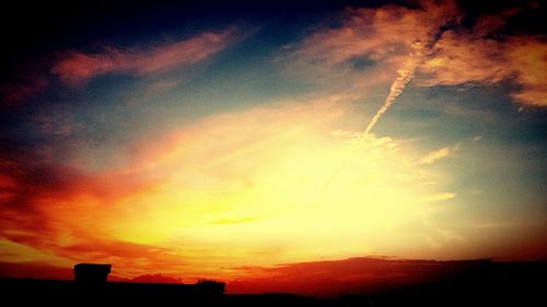 Low angle view of dramatic sky during sunset