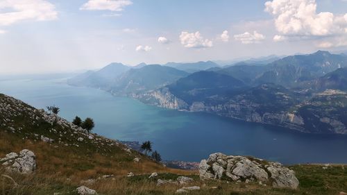 Scenic view of lake and mountains against sky