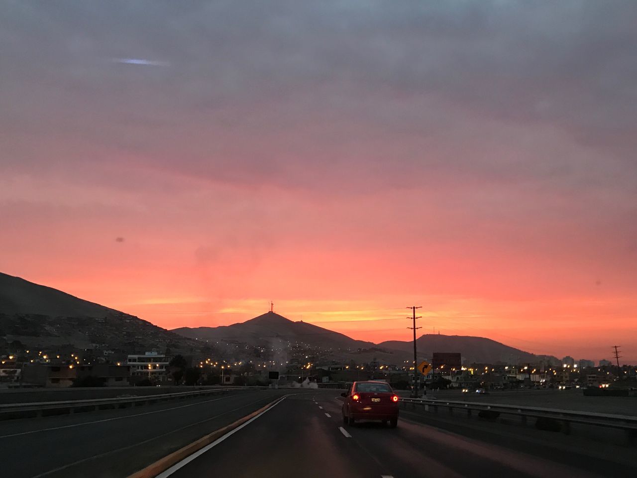 CARS ON ROAD AT DUSK