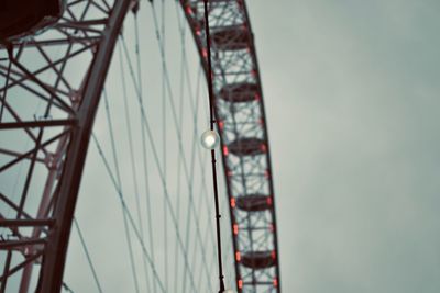 Low angle view of ferris wheel against sky