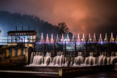 Illuminated fountain at night