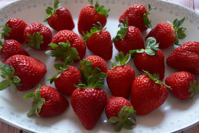 High angle view of strawberries in bowl on table