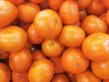 Full frame shot of oranges at market stall