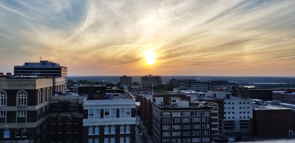 High angle view of buildings against sky during sunset