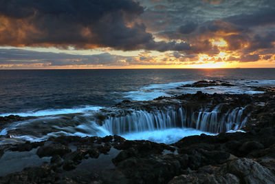 Scenic view of sea against sky during sunset