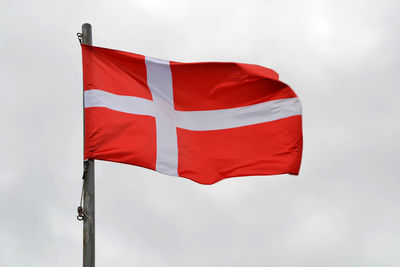 Low angle view of flag against sky