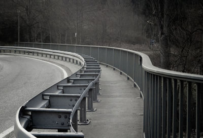 Empty railway bridge against trees