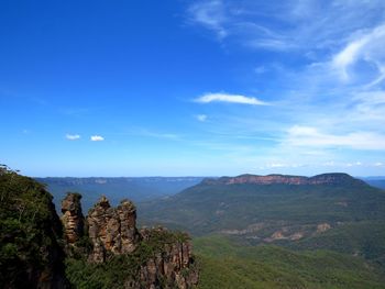 Scenic view of mountains against blue sky. the three sisters, blue mountains. nsw