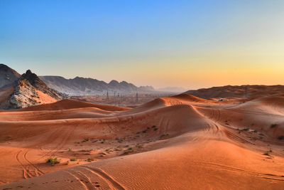 Scenic view of desert against clear sky