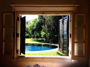 Swimming pool seen through window