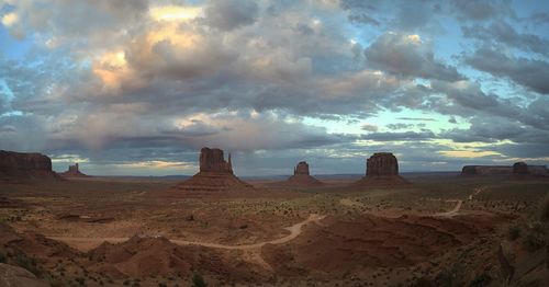 Scenic view of landscape against cloudy sky