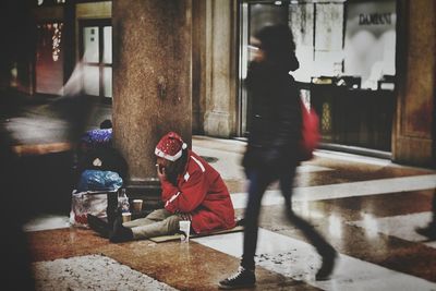 People walking on snow in city