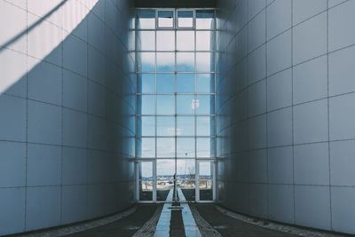 Sky seen through glass gate